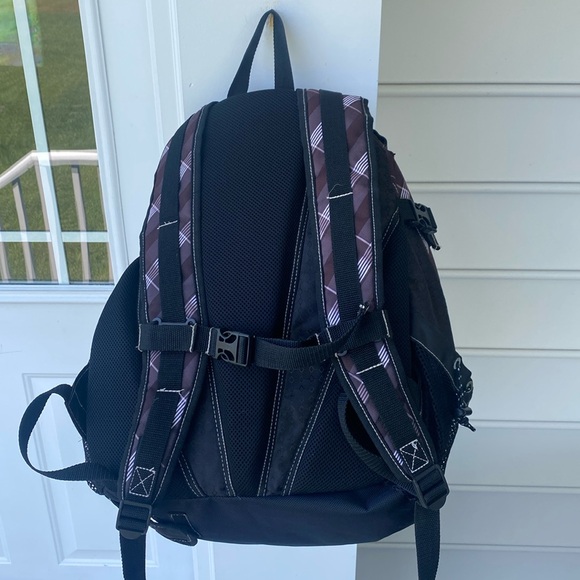 Warrior Lacrosse  Backpack holds lacrosse stick through channel interior of bag - Picture 2 of 13